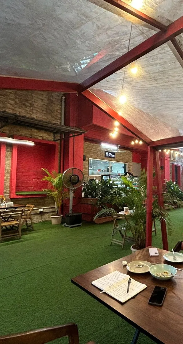 A notebook open on a table in the Pasticceria backyard during observation